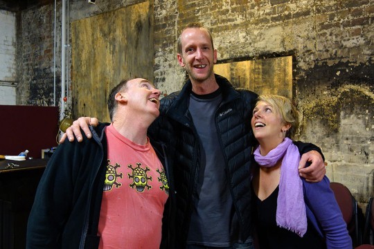 Michael Law and Tracey Skinner looking up to Dan Miller.