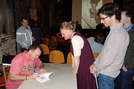 Michael signing books. Gitti Bulloch waiting expectantly with Steve Pollard behind.