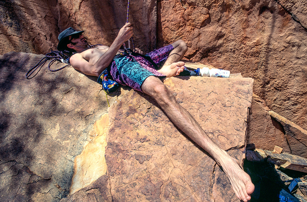 2. ATC. Ormiston Gorge (Northern Territory), 1996. Damien Auton obviously believes that belaying a mate on a difficult climb and an afternoon siesta should never be mutually exclusive.
